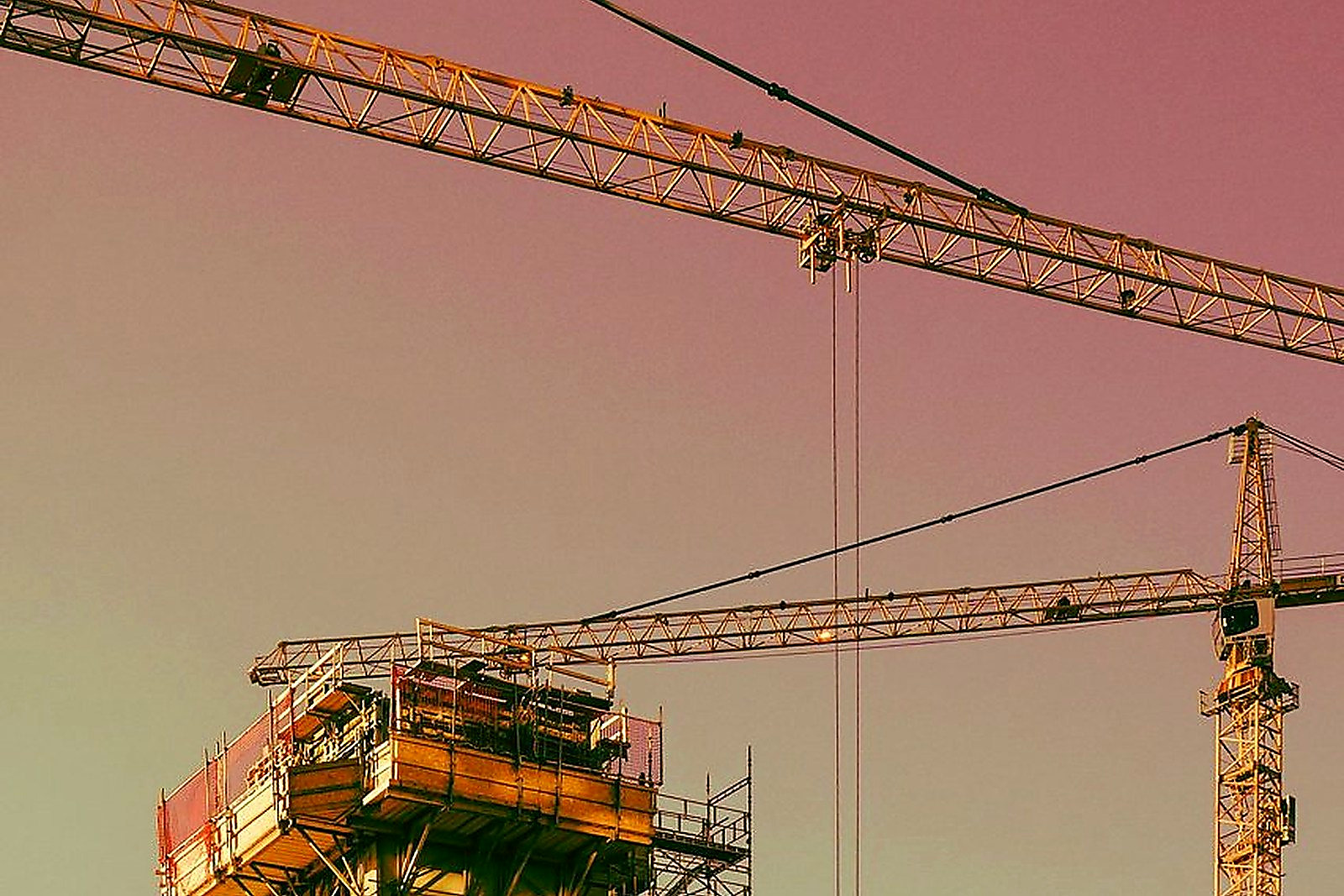 Free Vertical urban construction scene in Oslo featuring cranes and scaffolding. Stock Photo